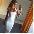 White sleek form fitting halter sexy dress midi length made of smooth fabric for elegant female wear
