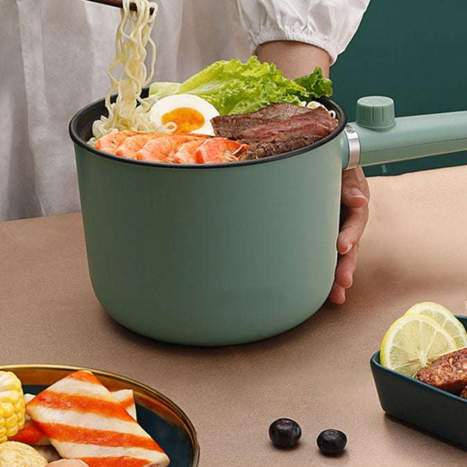 a sleek matte sage green electric noodle pot with handle and lid knob featured among the best home and kitchen essentials for your 2026 upgrade