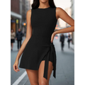 Cream-colored sleeveless yoga tennis skirt with a fitted bodice, flared skirt, and tied waistband side slit detail