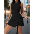 Black sleeveless mini yoga tennis skirt with fitted bodice and tied waistband featuring asymmetrical wrap skirt