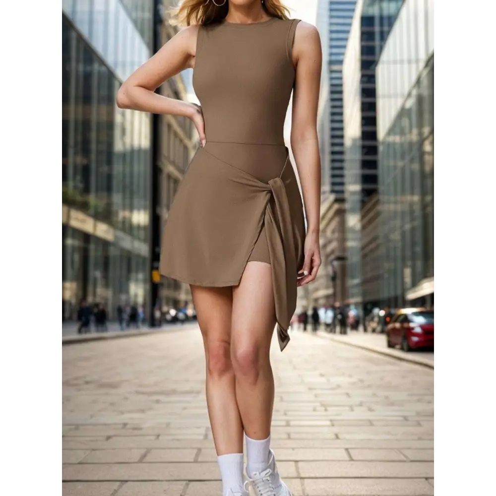Taupe sleeveless yoga tennis skirt sport dress with fitted bodice tied waistband and asymmetrical side slit hem