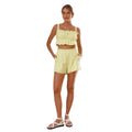 A light yellow ruffled crop sleeveless suspender shorts two-piece set with thin straps and high-waisted shorts
