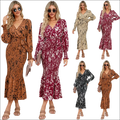 A slim-fit temperament v-neck printed belt dress with long sleeves and a flared skirt in abstract animal print colors