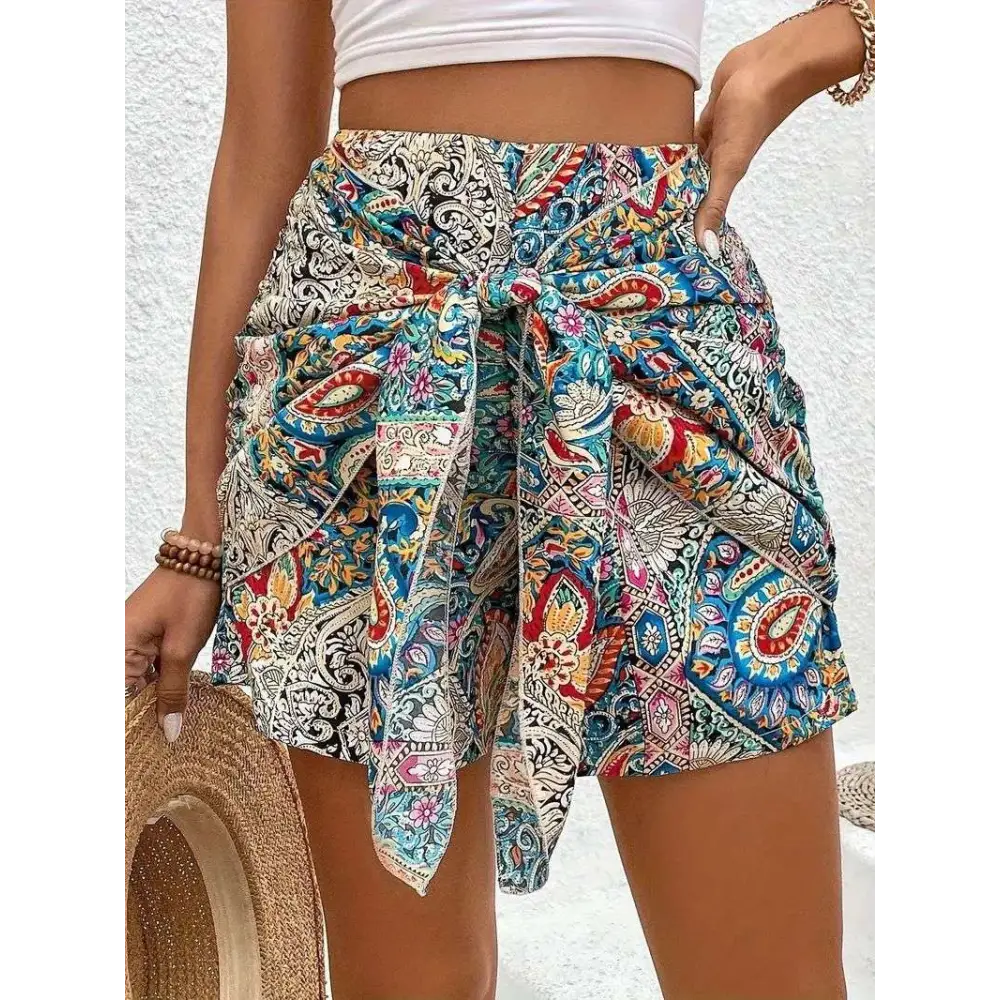 Slimming lace up printed irregular skirt with vibrant colorful paisley-patterned slimming fabric in blue red and cream