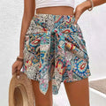 Colorful paisley-patterned slimming lace printed irregular skirt in blue red and cream with lace-up detail