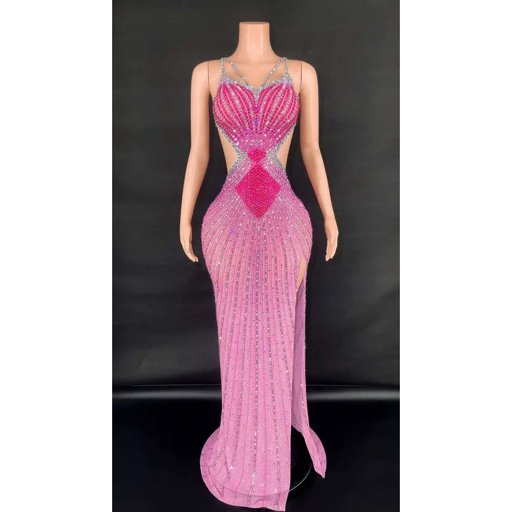 A shimmering pink sling super shiny beaded evening gown with silver diamond beading and a high slit