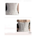 White small trailing wedding dress back with corset style and delicate beaded detailing layered tulle skirt