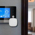 White square-shaped smart bluetooth finger robot with rounded edges and voice control applications attachment point