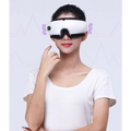 Smart eye massager with air bag technology and purple lighting in a sleek white and black ergonomic design