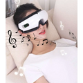 White and black smart eye massager with air bag technology, purple lighting, sleek curved design, and side control panel