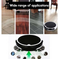 Black and white smart home sweeping robot with brush rolls and circular brush border for efficient home sweeping