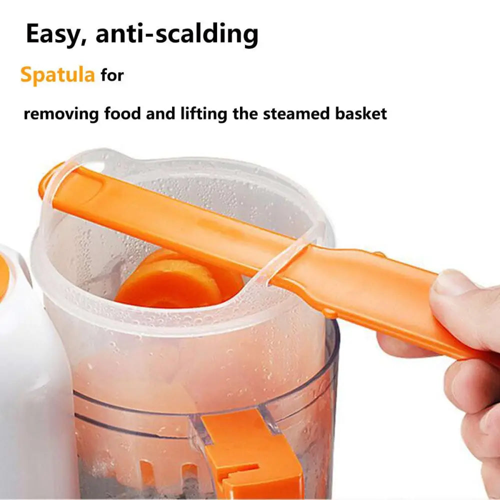 Orange plastic spatula with ergonomic handle used for baby food preparation in smart multi-function baby food processor