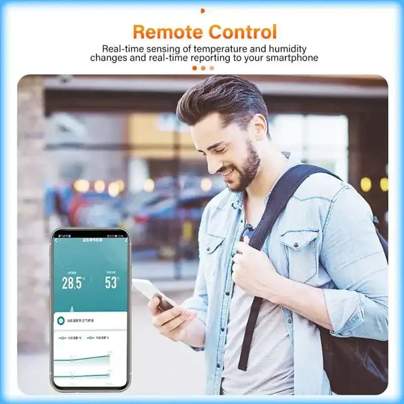 Smart wifi temperature and humidity sensor thermometer displaying real-time home’s climate data on a smartphone