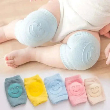 Soft pastel-colored smiley face baby knee pads designed for safety and comfort in baby safety products use