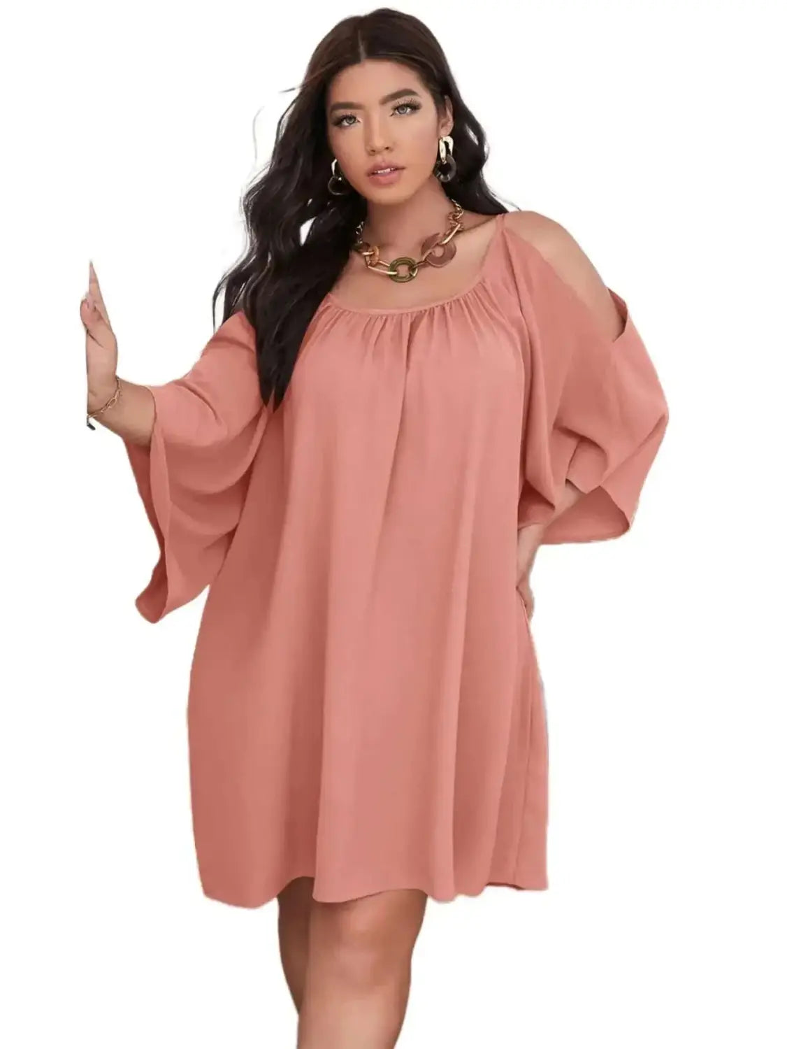 a soft peach-colored plus size dress with wide flowing sleeves and a square neckline designed for curvy women in 2026
