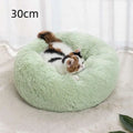 Soft plush winter warm pet bed in mint green with a circular shape and soft fluffy texture for cozy comfort