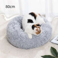 A cozy gray circular warm pet bed with plush winter warm material and soft fluffy texture for resting cats