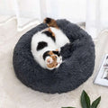 A plush winter warm dark gray circular cat bed with soft fluffy texture designed as a warm pet bed