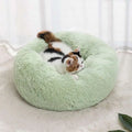 Soft mint-green plush winter warm pet bed with soft fluffy texture circular design for cozy comfort