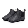 Black soft suede baby shoes with white lining and elastic side panels toddler booties for easy wear