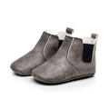 Gray soft suede baby toddler booties with elastic side panels and white stitching for comfortable wear