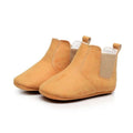 Soft suede baby toddler booties in tan with elastic side panels and a soft flexible sole for comfort