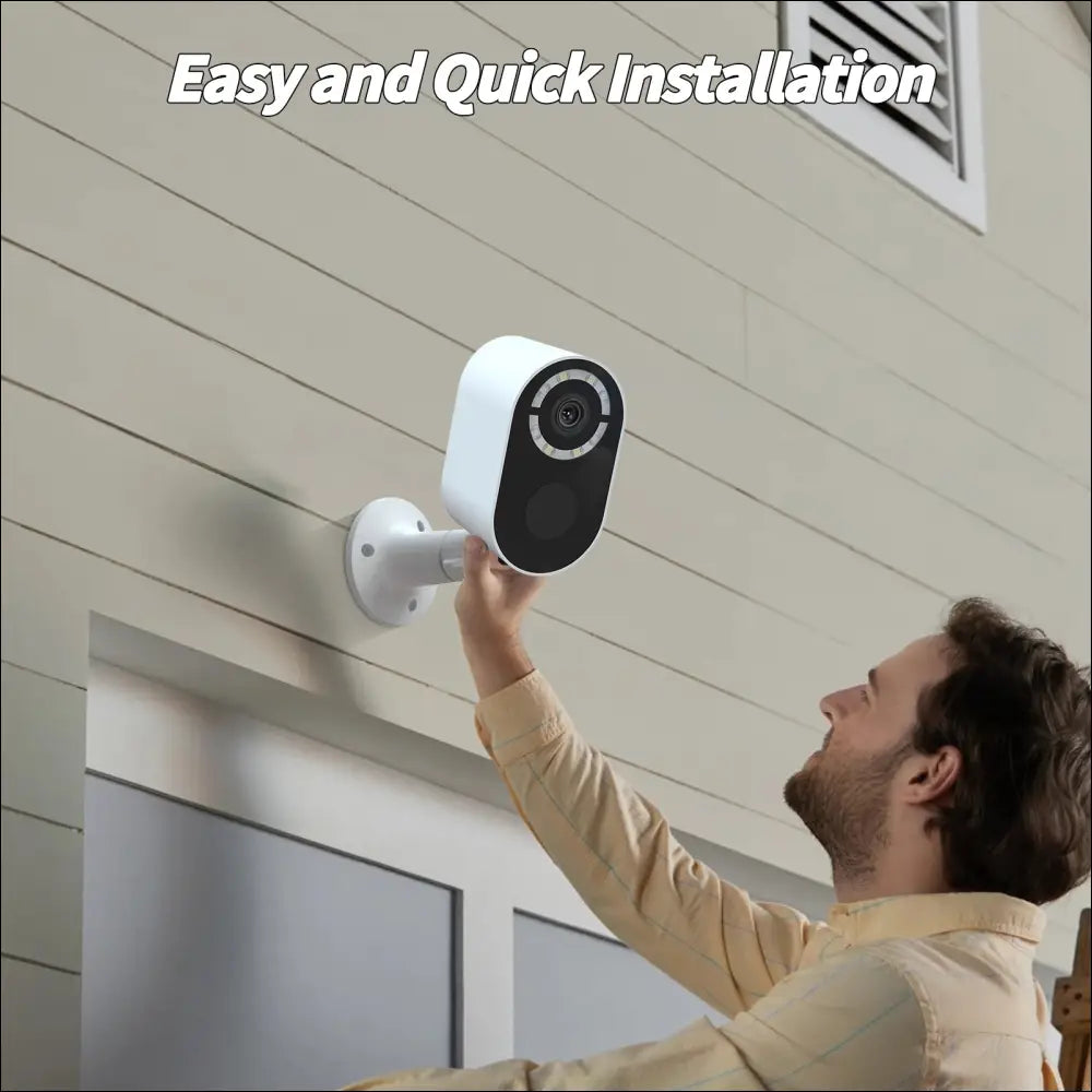 White and black solar powered wireless security camera with sleek modern design mounted on a wall for outdoor use