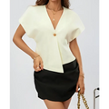 Cream-colored short-sleeved solid color basic blouse with v-neck and gold button closure in a basic versatile shirt style
