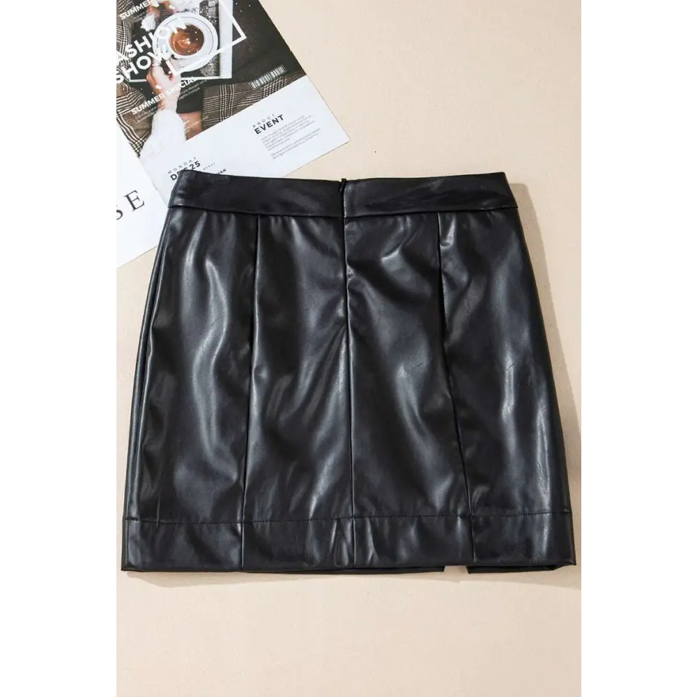 Black solid color high waist faux leather mini skirt with sleek glossy finish and vertical seam detailing