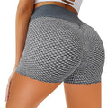 Black and white high-waisted solid color honeycomb design yoga shorts with textured mesh workout pattern