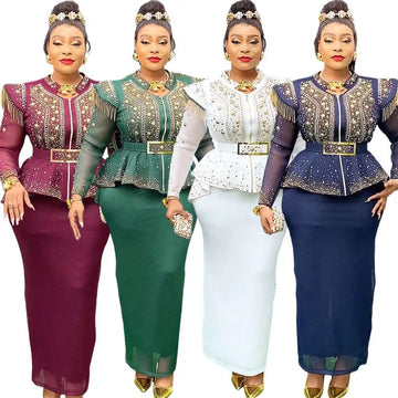 Four elegant women wearing hot drilling plus size two piece sets in burgundy green white and navy with gold embroidery