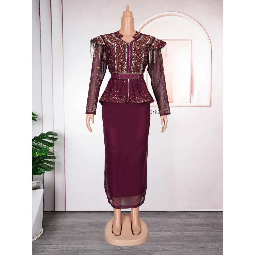 A maroon hot drilling plus size two piece set with a beaded fringed sheer long sleeve top and high waisted skirt