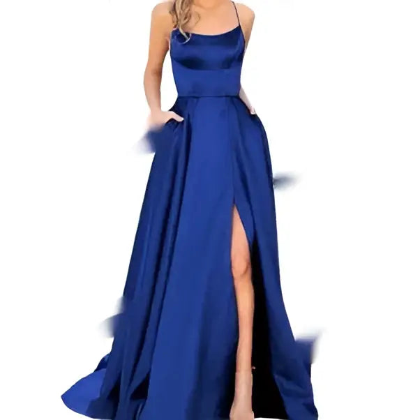 A flowing royal blue satin evening gown with high slit and thin spaghetti straps ideal for formal occasions
