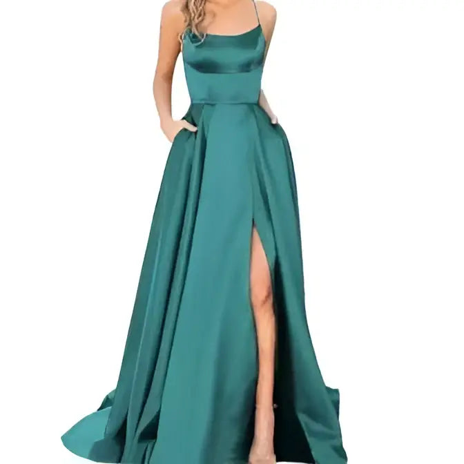 Emerald green satin evening gown with a fitted bodice and flowing skirt complements the purple satin evening gown collection