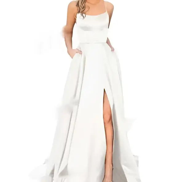 A flowing white satin evening gown with delicate spaghetti straps and a high slit in a solid color design