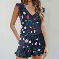 Navy blue floral print bikini ruffled romper swimwear with v-neckline, tiered design, and ruffled sleeves and hem