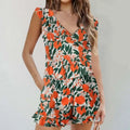 A vibrant orange and green color printing bikini ruffled romper swimwear with ruffled sleeves waistband and hem