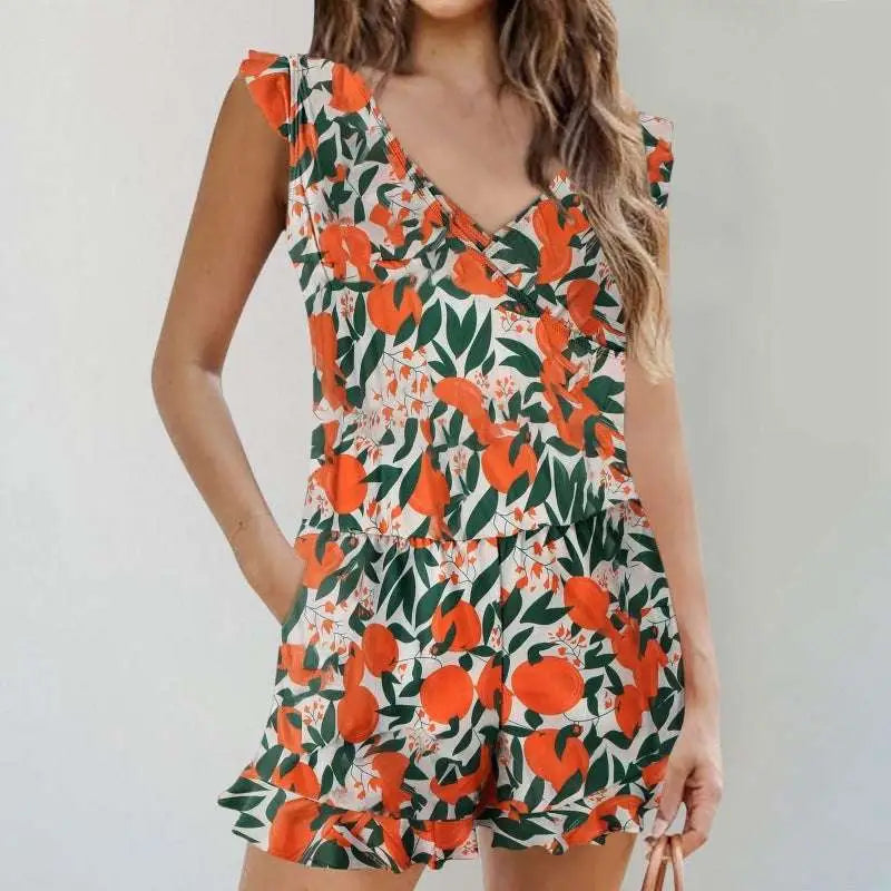 A vibrant orange and green color printing bikini ruffled romper swimwear with ruffled sleeves waistband and hem