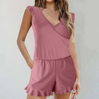 A soft mauve color printing bikini ruffled romper swimwear with shoulder ruffles and a flared hem design