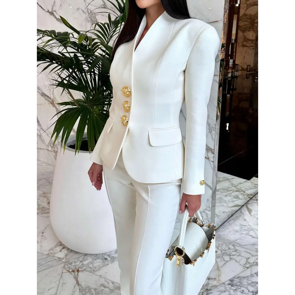 White tailored solid color single-breasted blazer with gold-tone ornate buttons and structured shoulders in pants set