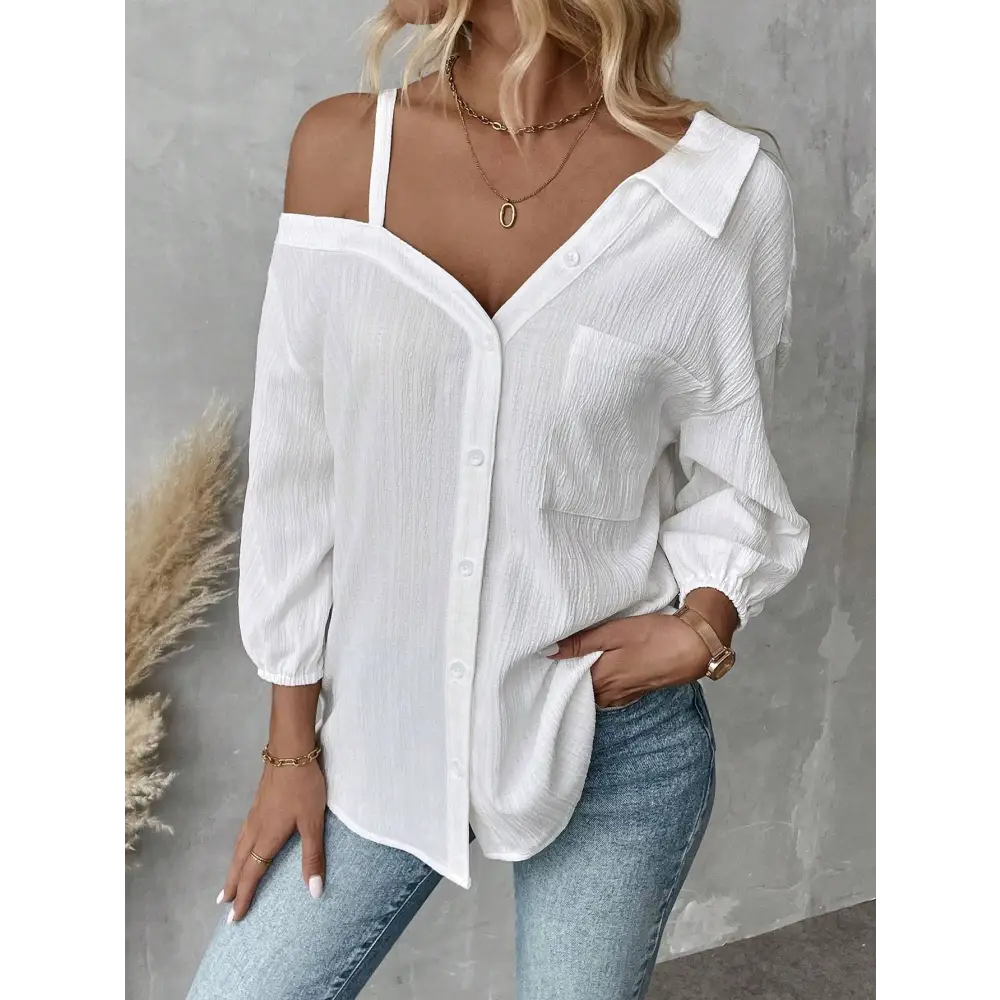 White asymmetric blouse featuring a sheer textured fabric with off-the-shoulder design and subtle pleats