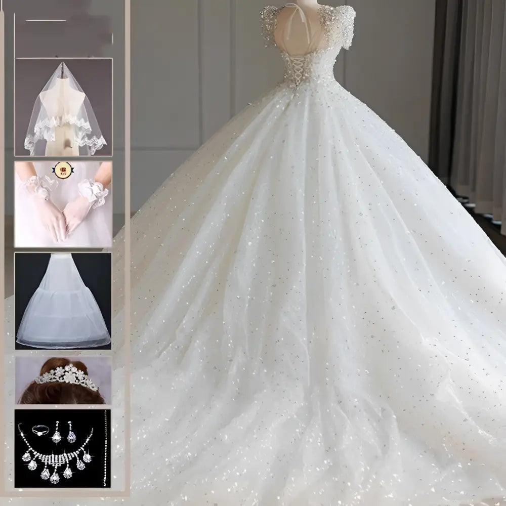 A sparkling beaded white wedding dress with off-the-shoulder sleeves and a voluminous skirt with scattered sequins