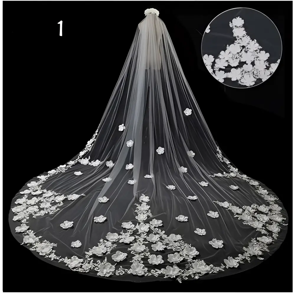 A flowing white sparkling wide style bridal wedding dress veil with intricate floral glitter cascading from the bride’s head