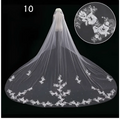 A delicate white lace wedding dress veil with intricate floral embroidery and subtle beading for bridal wedding dress