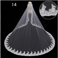 A delicate white lace wedding dress veil with intricate floral embroidery displayed on a mannequin for bridal wedding dress use