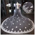 Sparkling wide style bridal wedding dress veil in white lace with intricate floral embroidery and scalloped edge