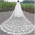 A long flowing white lace wedding dress veil with intricate floral appliqués for bridal wedding dress use