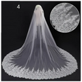 A delicate white lace wedding dress veil with an intricate floral scalloped edge for bridal wedding dress use