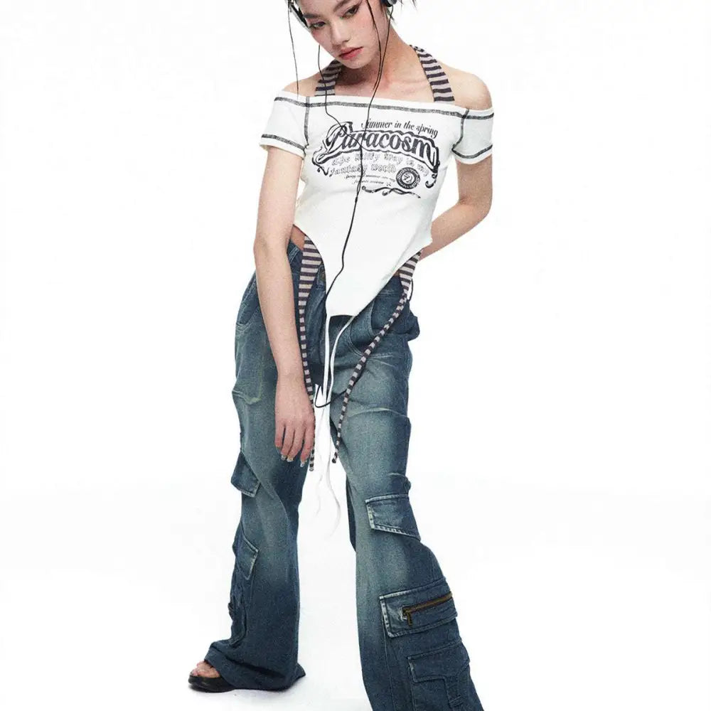 White off-the-shoulder crop top with black graphic print and striped shoulder straps from spicy girls summer luxury women’s fashion