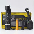 Black spiked tactical self-defense led flashlight with textured grip, silver accent ring, and wrist strap for secure handling